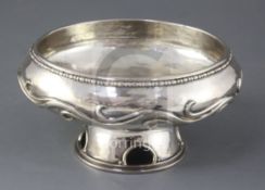 A decorative silver footed bowl after a 1938 design by Omar Ramsden, London 1975, Maker: Rodney C.