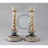 A pair of Doulton Lambeth stoneware candlesticks, with applied spiral fluted decoration, height