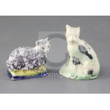 A Whieldon type creamware figure of a cat, c.1780 and a tinglaze figure cat on a cushion, possibly