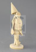 A Japanese ivory figure of a bijin, early 20th century, the standing figure holding a parasol,