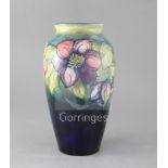 A Moorcroft clematis pattern baluster vase, c.1940s impressed mark W.Moorcroft potter to HM the