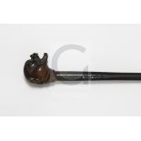 A Victorian rhinoceros horn handled 'mastiff' walking stick, late 19th century, ebonised shaft,