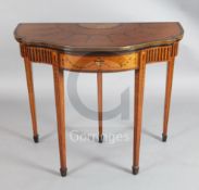 A James Shoolbred Sheraton Revival marquetry inlaid satinwood card table, with serpentine folding