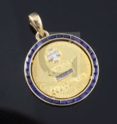 An 18ct gold French diamond and gem set "Qu'Hier Que Demain" pendant, 25mm.