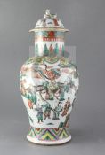 A Chinese famille verte baluster vase and cover, late 19th century painted with an emperor and court