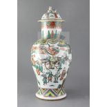 A Chinese famille verte baluster vase and cover, late 19th century painted with an emperor and court