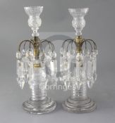 A pair of Regency cut glass table lustres, the facetted bases surmounted by gilt brass mounts