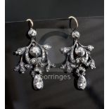 A pair of 19th century gold, silver and diamond drop earrings, of scrolling design, set with old
