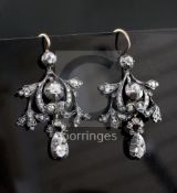 A pair of 19th century gold, silver and diamond drop earrings, of scrolling design, set with old