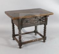 A 17th century Spanish walnut table the rectangular top raised on bobbin turned legs joined by