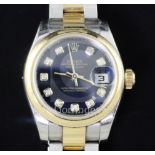 A lady's stainless steel and yellow gold Rolex Oyster Perpetual Datejust wrist watch, with blue dial