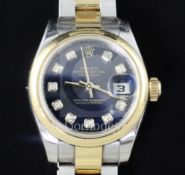 A lady's stainless steel and yellow gold Rolex Oyster Perpetual Datejust wrist watch, with blue dial