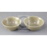 Two Chinese Longquan celadon bowls, Song dynasty (11th/12th century) each incised with petals to the