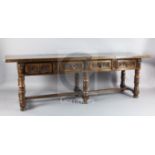 A mid 17th century Italian walnut table, the rectangular single plank top with frieze carving and