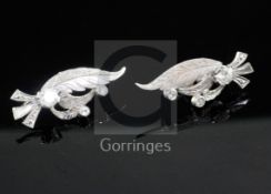 A pair 9ct white gold and diamond scrolling leaf shaped ear clips, 30mm.