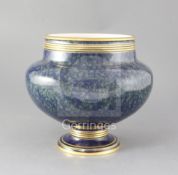 A large Sevres mottled blue ground jardiniere, dated 1881 with gilt banded decoration, brown and