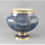 A large Sevres mottled blue ground jardiniere, dated 1881 with gilt banded decoration, brown and