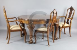 An Edwardian Queen Anne revival walnut extending dining table and set of 8 matching dining chairs