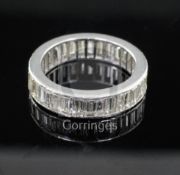 A mid 20th century platinum? and baguette cut diamond full eternity ring, set with thirty one