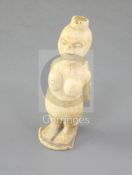 A 19th century African ivory group of a mother and child, height 3.25in.