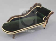 Denis Hillman. A Victorian mahogany miniature scroll end chaise longue, upholstered in green velvet,