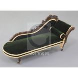 Denis Hillman. A Victorian mahogany miniature scroll end chaise longue, upholstered in green velvet,