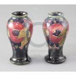 Two Moorcroft miniature pomegranate pattern baluster vases, green W Moorcroft signatures and