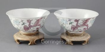A pair of Chinese famille rose 'phoenix' bowls, Guangxu period, each finely painted with fenghuang