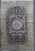 An Isfahan carpet, with field of scrolling foliage, on an ivory ground, 8ft 4in by 4ft 8in.