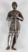 A 16th century Continental carved limewood figure of a knight, the full length figure shown in