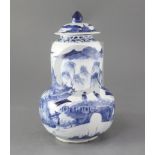 A Chinese blue and white gourd-shaped vase and cover, late 19th century, painted with figures amid
