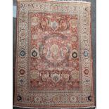 A Ziegler carpet, the madder field with an indigo vine trellis with bold palmettes, leaves and