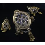 A Victorian gold, enamel and split pearl set demi-parure, comprising an oval drop tassel brooch