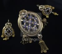 A Victorian gold, enamel and split pearl set demi-parure, comprising an oval drop tassel brooch