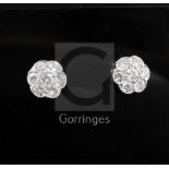 A pair of platinum and diamond seven-stone cluster ear studs, 12mm.