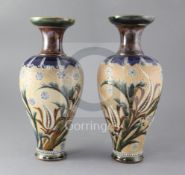 A pair of Royal Doulton stoneware baluster vases, decorated by Eliza Simmance, with stylised foliate