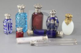 A collection of nine assorted early 20th century silver mounted scent bottles, including double