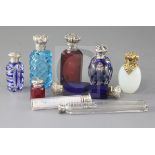 A collection of nine assorted early 20th century silver mounted scent bottles, including double