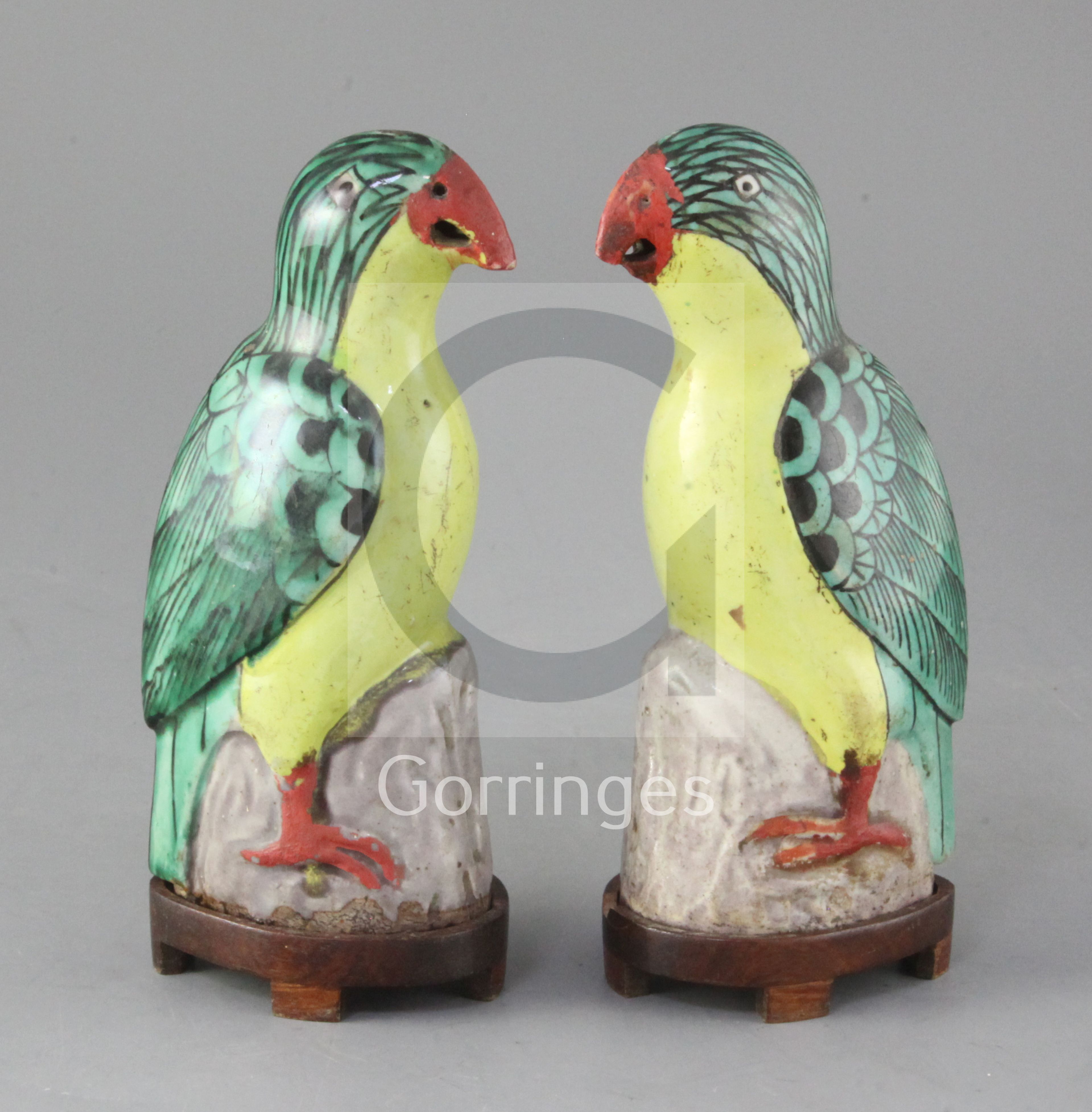 A pair of Chinese porcelain models of parrots, Qianlong/Jiaqing period, each with green and yellow