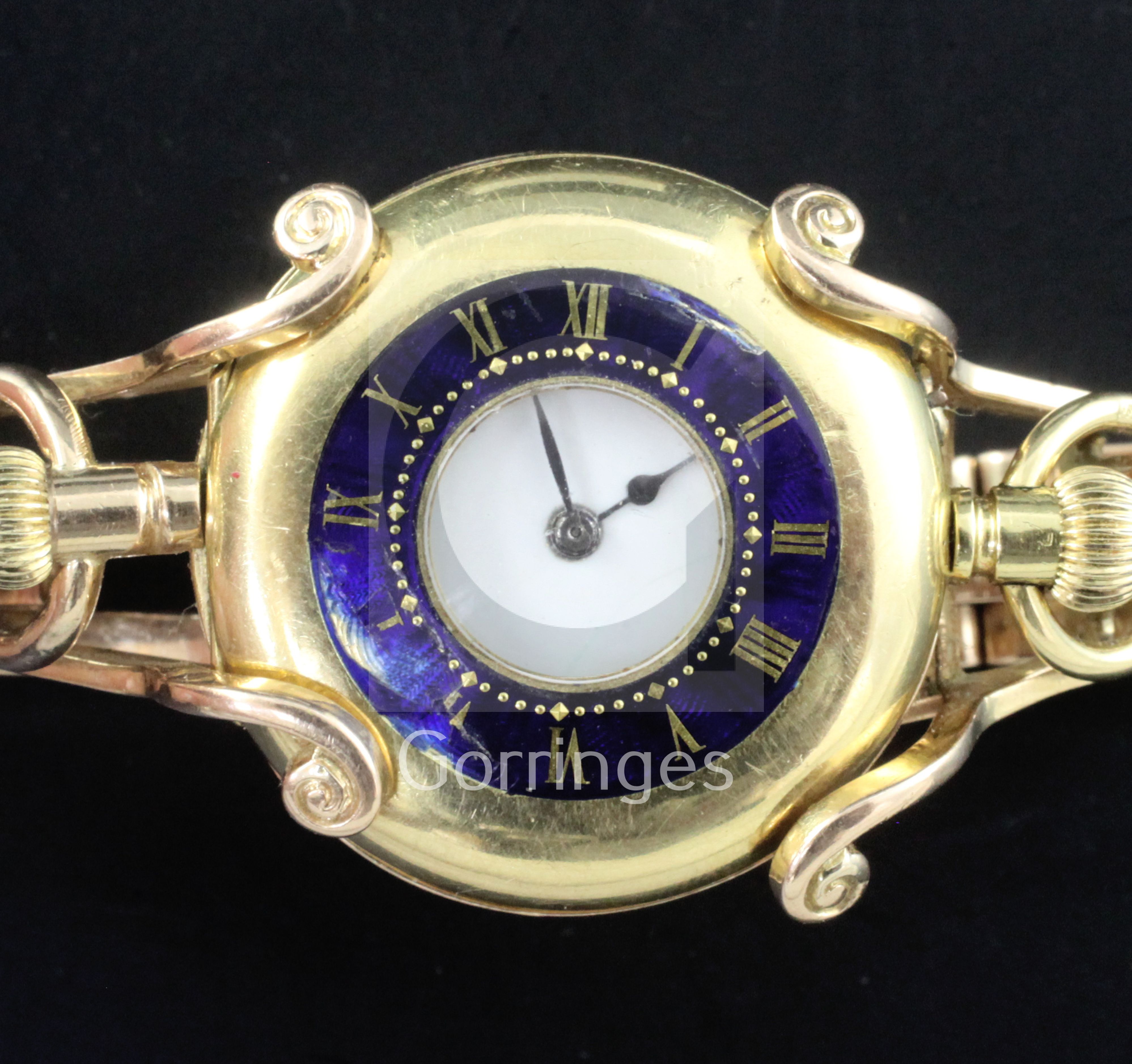 An early 20th century 18ct gold half hunter fob watch with a 15ct gold bracelet, the bracelet