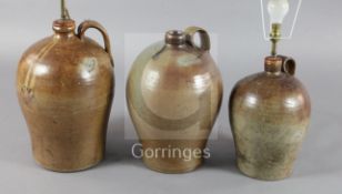 Three saltglaze stoneware flagons, with wide strap handles, fitted for electricity, tallest 18in.