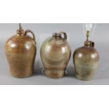 Three saltglaze stoneware flagons, with wide strap handles, fitted for electricity, tallest 18in.