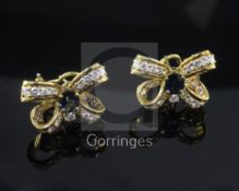 A pair of 18ct yellow gold, sapphire and diamond 'ribbon bow' earrings, with post and clip