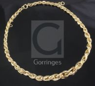 An 18ct gold graduated link choker necklace, in Garrard's fitted box, 38cm.