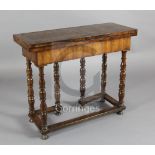 An early 18th century marquetry inlaid walnut side table, with folding top resting upon a double