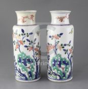 A pair of Chinese wucai cylindrical vases, Kangxi period, late 17th century, each painted with birds