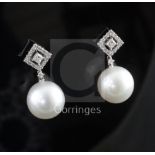 A pair of 18ct white gold and South Sea pearl drop earrings, 1in.
