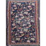 A 19ct century Senneh rug, with polychrome file of stylised motifs, 6ft 3in by 4ft 5in.