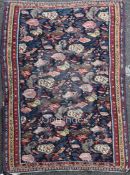 A 19ct century Senneh rug, with polychrome file of stylised motifs, 6ft 3in by 4ft 5in.