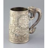 A mid-19th century Chinese silver mug, the body featuring warriors fighting to one side, with